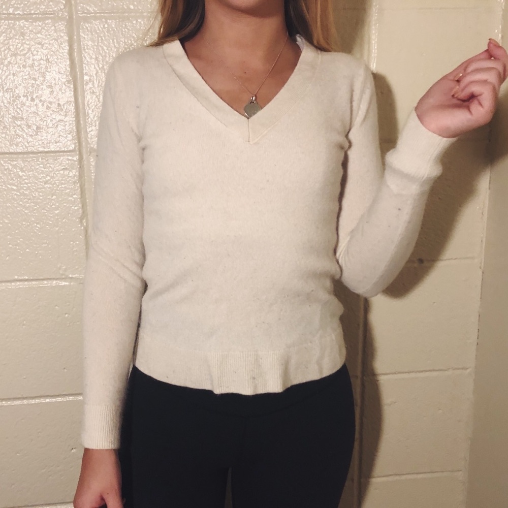 White v-neck cashmere sweater.